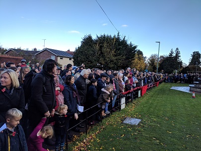 Photo of the Veterans and general public watching the War Memorial Service in the Road