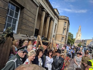 Photo of Allo Allo Cast in front of the GLOS100 Trench