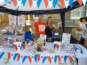Photo of GCN trustee, Jill Davies and GCN Volunteer, Marie Bufton on the Tombola stand raising money for the Combat Stress Charity