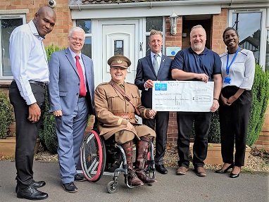 Chris prsenting a cheque to Alabare ex-Homeless Veterans Home in Gloucester